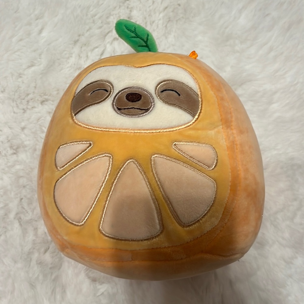 Simon the Sloth in orange costume